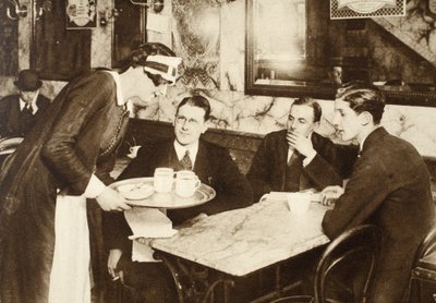 A cafe waitress, wearing the same uniform as a parlour maid, serving coffee to office workers during their 11 o